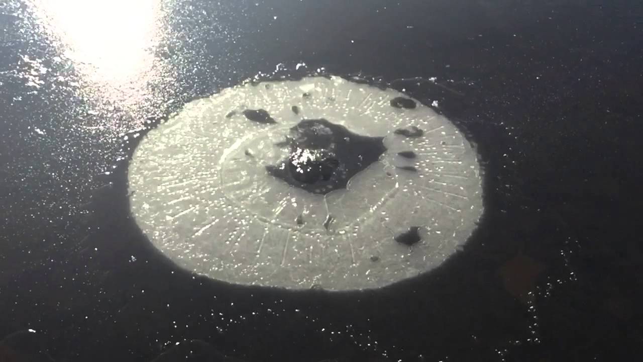 Slow motion stone through Ice