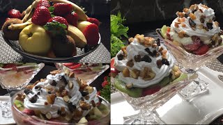 سلطة الفواكه الرائعة بالكريمة و الياغورت و الفواكه الجافة، قدميها لضيوفك. Salade de fruits