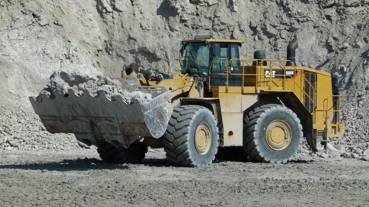 MASSIVE Caterpillar 988K wheelloader loads 775G trucks - YouTube
