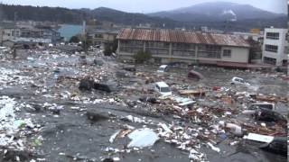 Tsunami in Kesennuma city, ascending the Okawa river