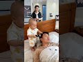 baby playing with baby 😂 자고 있는 아빠 머리를 살짝 밀어보는 아기가 너무 귀엽고 웃기다 🤣💛💖