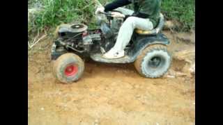 my brothers racing mower with new tires - mini mud hole