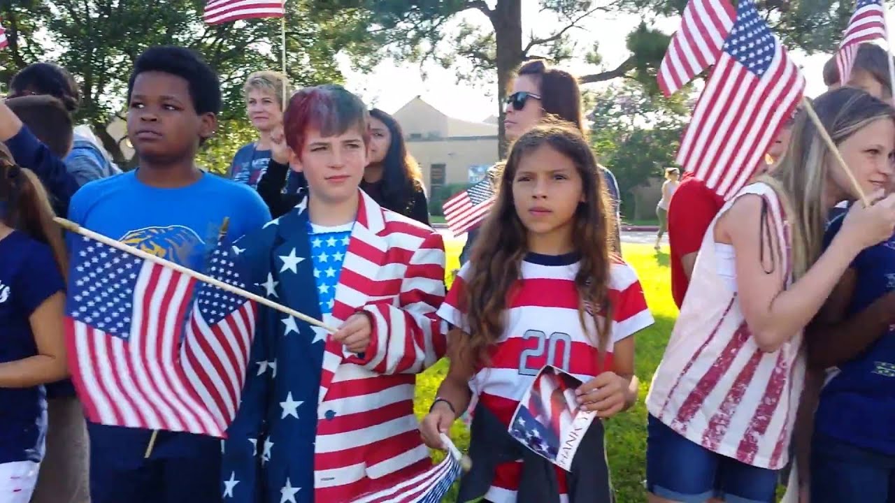 Pine Forest Elementary Students Show Patriotic Pride While Greeting Pine Forest Elementary Students Show Patriotic Pride While Greeting