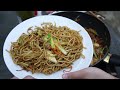 Outdoor cooking: Stir fry noodles with pork and vegetables