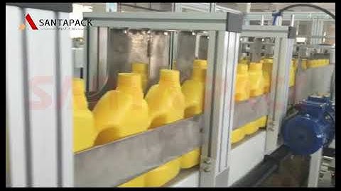 Falling type case packer for motor oil