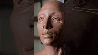 Sculpting The Eyes And General Shapes Of A Figure Out Of Clay