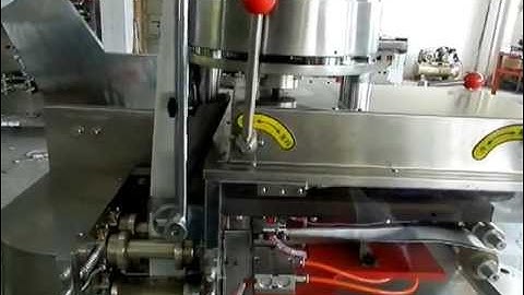Automatic tea bags packaging machine with string and tag.MOV