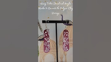 Decorate polymer clay earrings with acrylic markers and temporary tattoo stencils