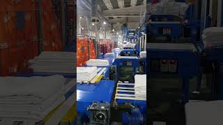 SISTEMA DE DESCARGA DE TOALLAS EN UNA LAVANDERÍA INDUSTRIAL