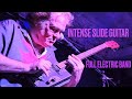 Intense 4 string slide cigar box guitar blues version of red rooster with drums and bass in concert