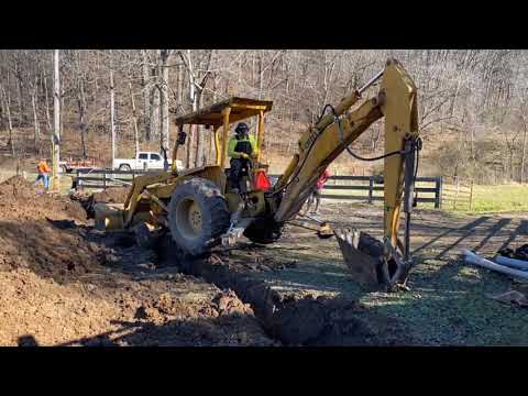 Moving Backhoe Across Trench