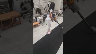 Kaitlyn is vacuuming