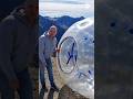 Human hamster ball down a mountain
