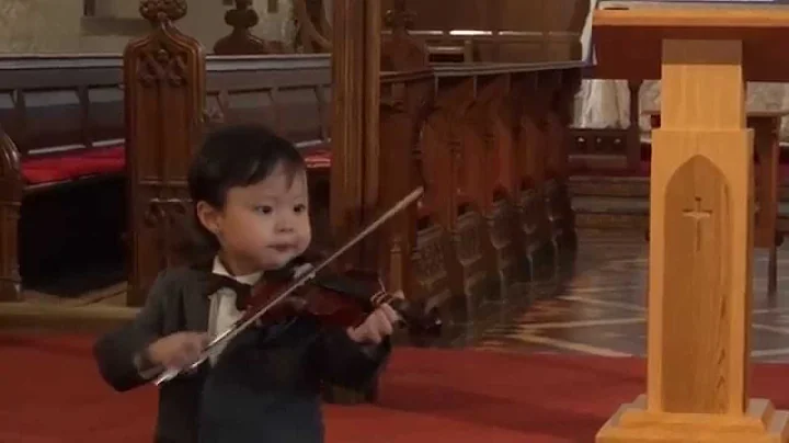 Joshua Tan, aged 3, performing violin at his first...