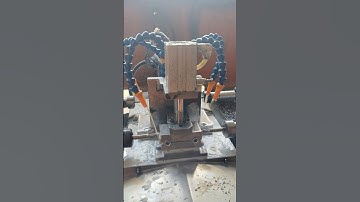 Drilling holes on both ends of the iron plate