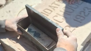 Removing the cornerstone from the 100-year-old Atlanta High School building in Atlanta, Missouri