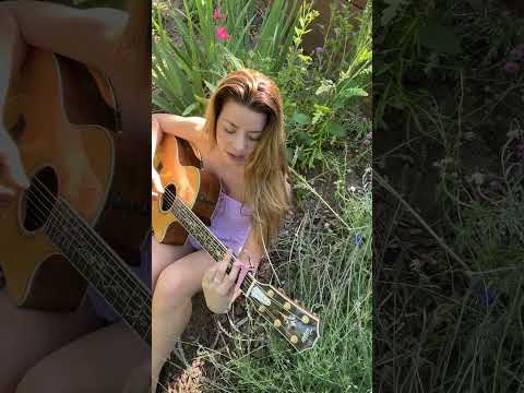 sat in the garden feeling out how she wants to be played 🌿 should I record a full acoustic version?