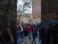 Protesters stand outside Sen. Susan Collins' office