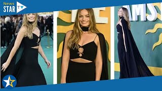 Margot Robbie Unveils Tribute To The Queen With Long Black Cape