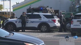 Suspect barricaded inside gun shop in Hampton in custody