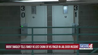 Brent Swadley tells family he lost chunk of his finger in jail door incident