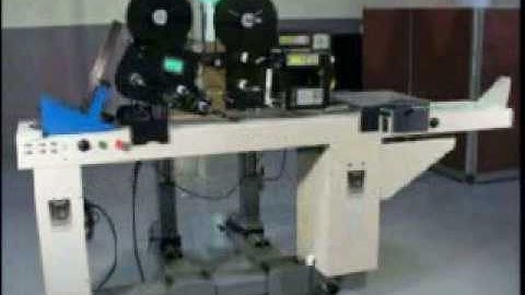 Label Printer Applicator with Label Applicator applying two labels to small tags