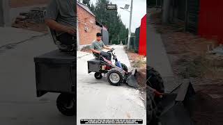 Moving soil on roadside area using mini loader