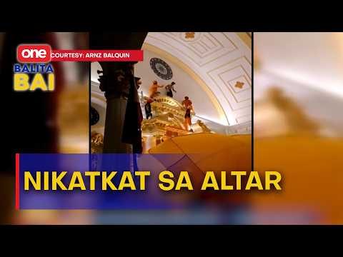 Lalaki, nisaka sa ibabaw sa altar sa San Sebastian Cathedral sa Bacolod City.