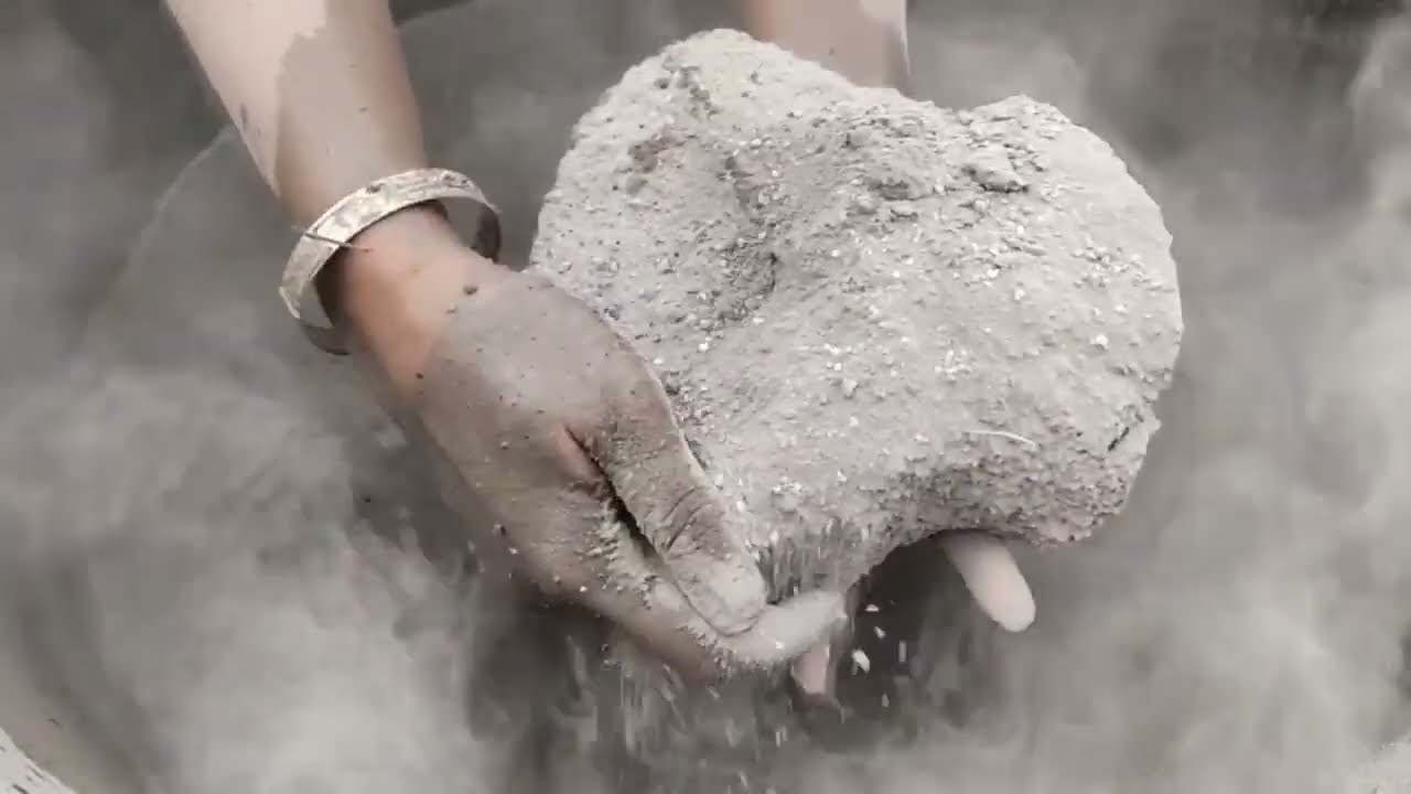 Soft dusty sand cement chunks crumbling in lots of water #sand