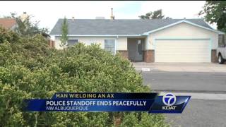 Man Wielding Ax at Police