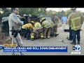 5 people hurt after 2 vehicles crash and roll 200 feet down 405 Fwy embankment
