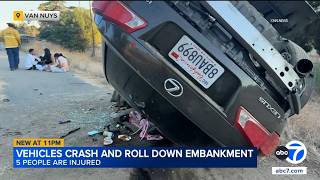 5 people hurt after 2 vehicles crash and roll 200 feet down 405 Fwy embankment