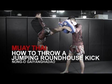 Muay Thai: How To Throw A Jumping Roundhouse Kick | Evolve University