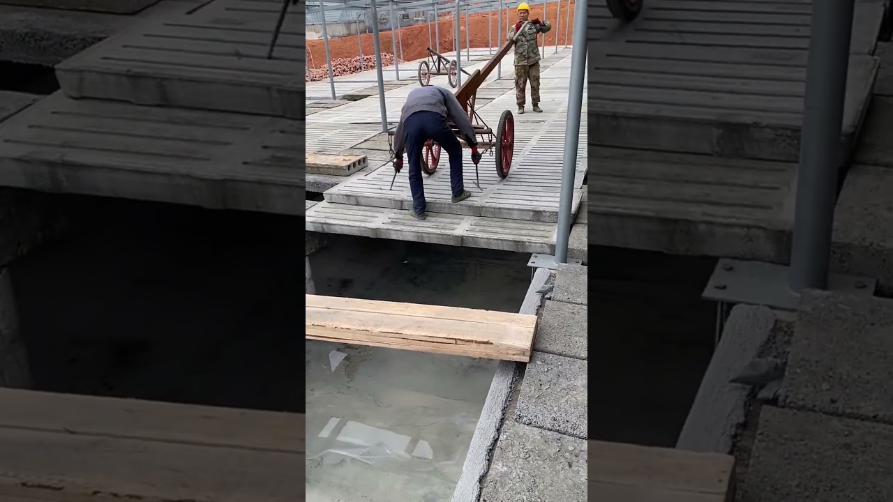 Workers are installing livestock concrete slatted floor