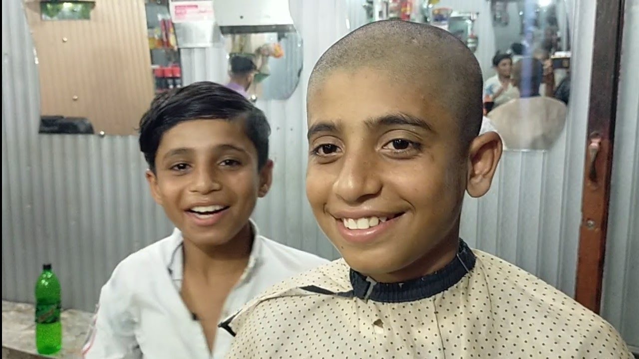head shave barber with clipper village boy in haircut salon punjab