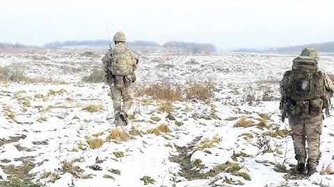 Officer Cadets practice section attacks on the live firing range as part of Exercise Dynamic Victory
