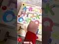 Alphabet from A to Z on a wooden board with magnetic balls