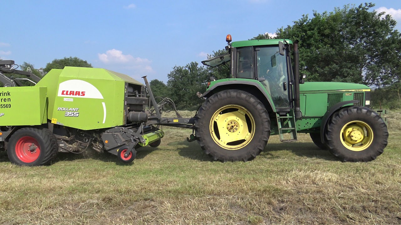 RONDE BALEN PERSEN EN WIKKELEN MET JOHN DEERE 6510 CLAAS ROLLANT 355