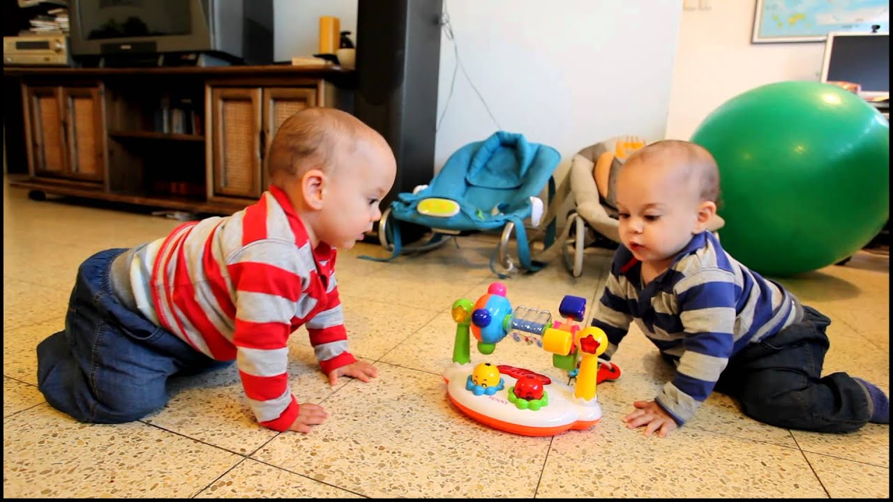 9 months old twins dancing and trying to get the music back