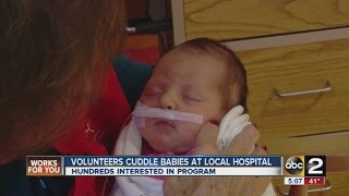 Volunteers cuddle babies at Mt. Washington Pediatric Hospital