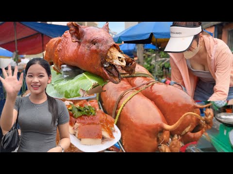 Whole roasted pig with crispy skin at the festival attracts many girls to come and eat. Roast pork 