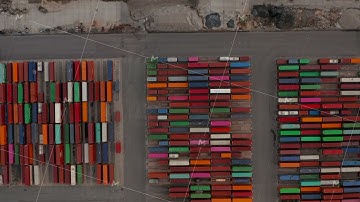 Overhead top down aerial view of colorful cargo containers in large port in Hamburg, Germany