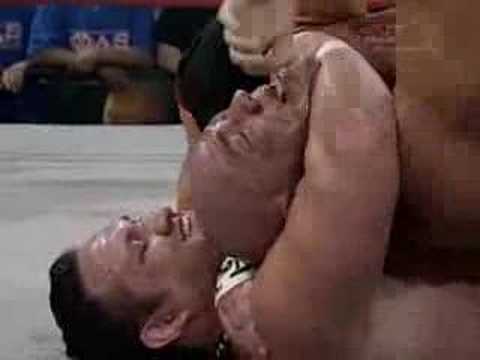 Wrestling Moves - Rear Naked Choke by Samoa Joe on Kurt Angle