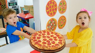 يتعلم الأطفال كيفية طهي البيتزا ومساعدة بعضهم البعض