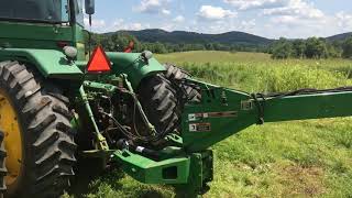 John Deere 8430 articulator pulling John Deere 946 moco