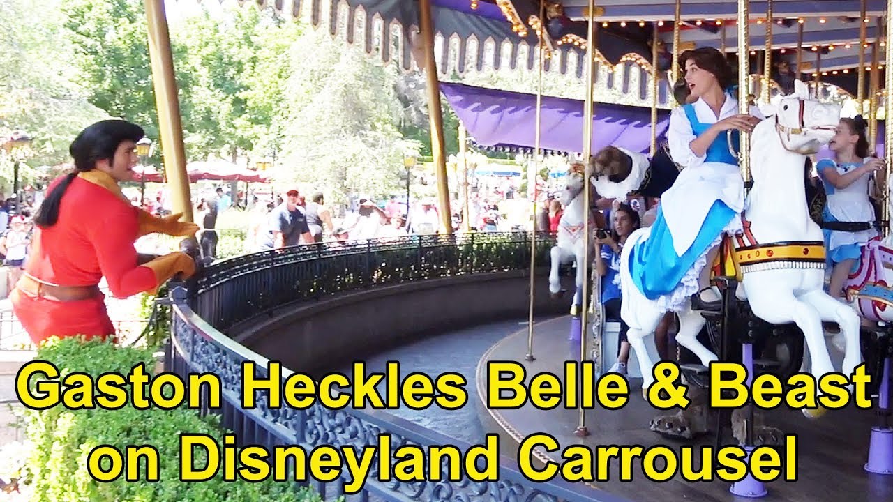 walt disney world vacation Gaston Heckles Belle & The Beast at Disneyland as they Ride King Arthur Carrousel in Fantasyland