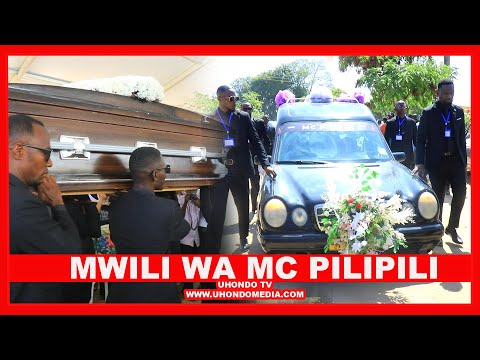 A CONVEYANCE OF VEHICLES ACCOMPANYING THE LATE MC PILIPILI TO HIS OFFICIAL FUNERAL