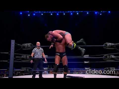 Bobby Roode sends Eric Young through table