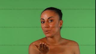 Gorgeous African woman blowing kisses to the camera