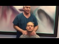 La man gets neck adjusted differently by houston chiropractor dr gregory johnson
